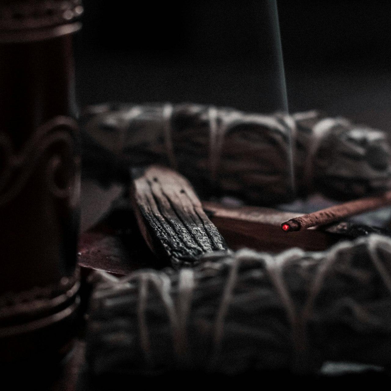 shallow focus photography of lighted incense